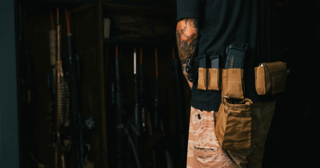 A man putting on his battle belt from Blue Alpha getting ready for drills.