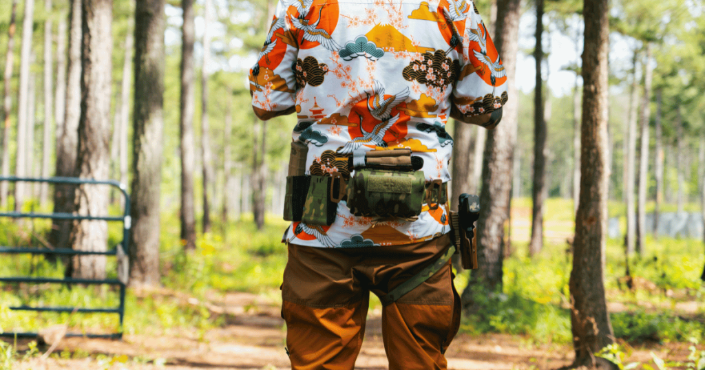 A man wearing a Blue Alpha Battle Belt with a vertical mag pouch.