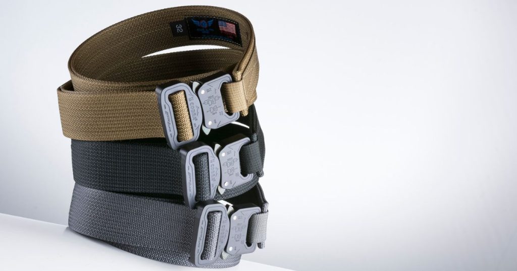 Three Blue Alpha EDC Belts stacked on each other against a white background.