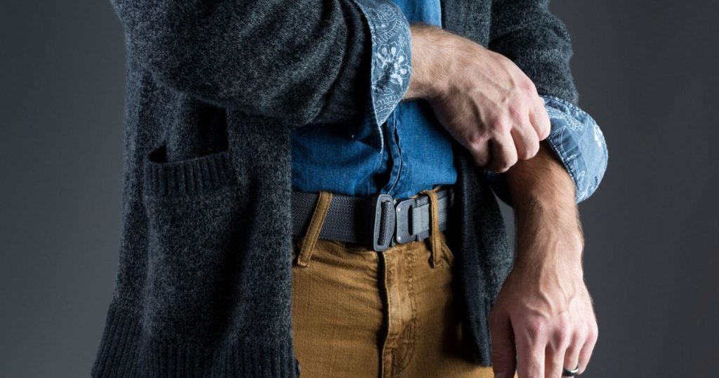 A man in a casual outfit wearing a Blue Alpha EDC Belt with this pants.