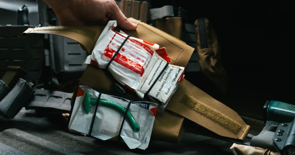 A Blue Alpha Medical Pouch open showing the contents and insert.